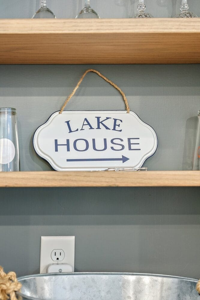 Lake House sign on shelf.