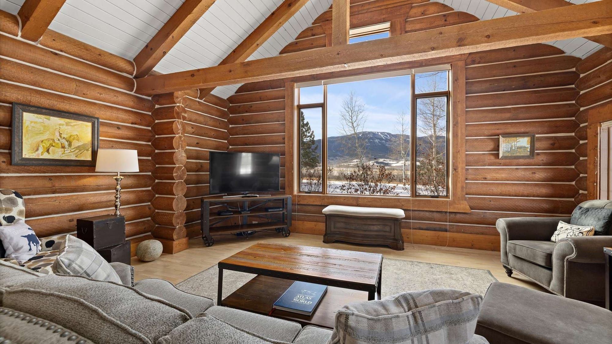 Cozy log cabin living room view.