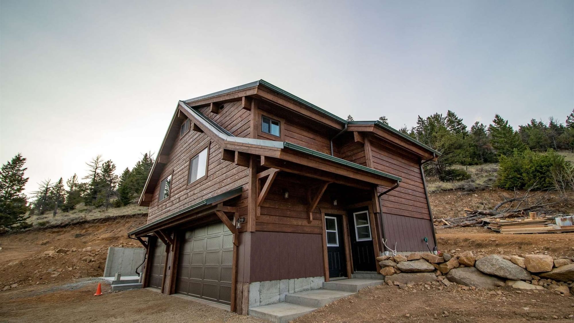 Wooden house on sloped terrain.