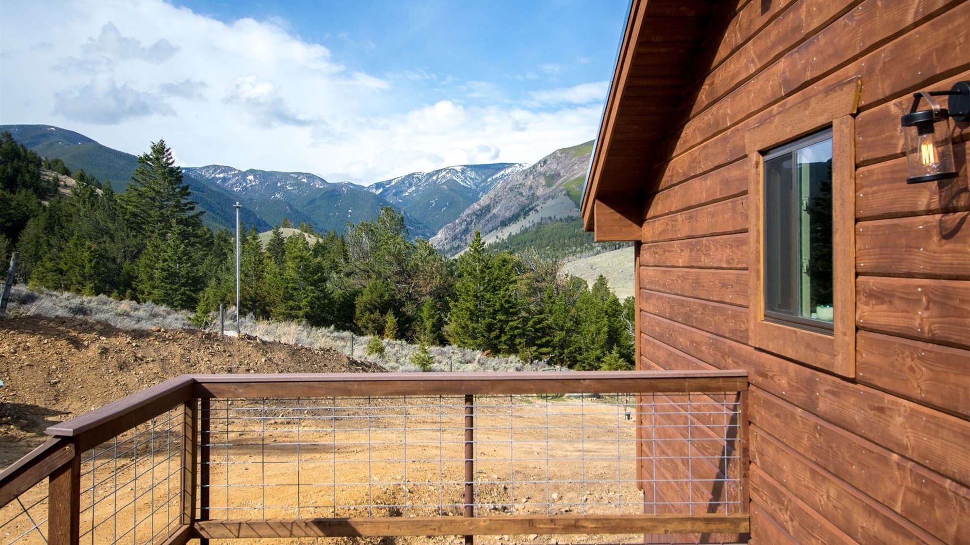 Cabin deck with mountain view.