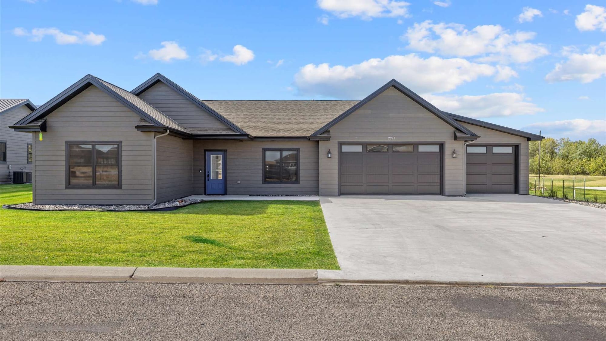 Modern single-story house with garage.