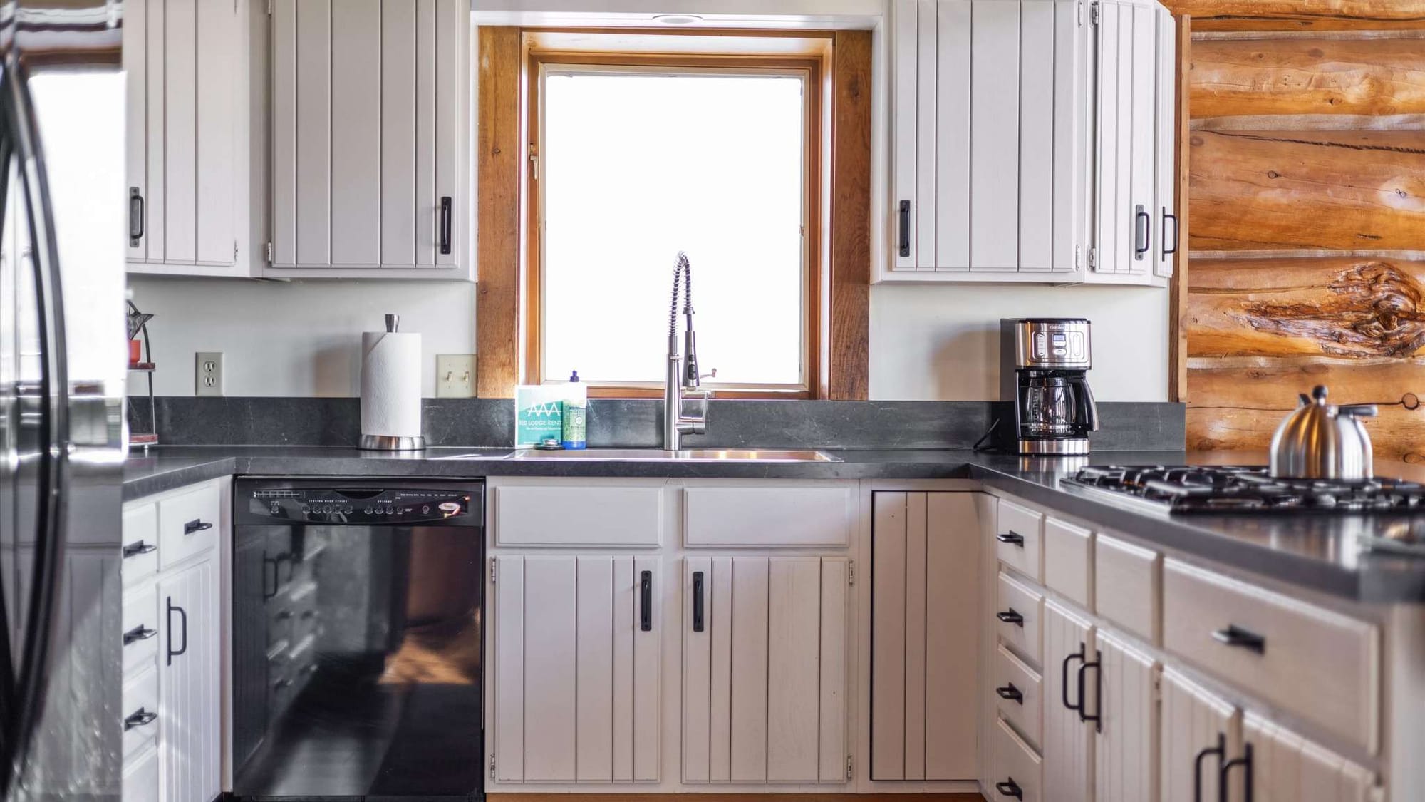 Modern kitchen with white cabinets.