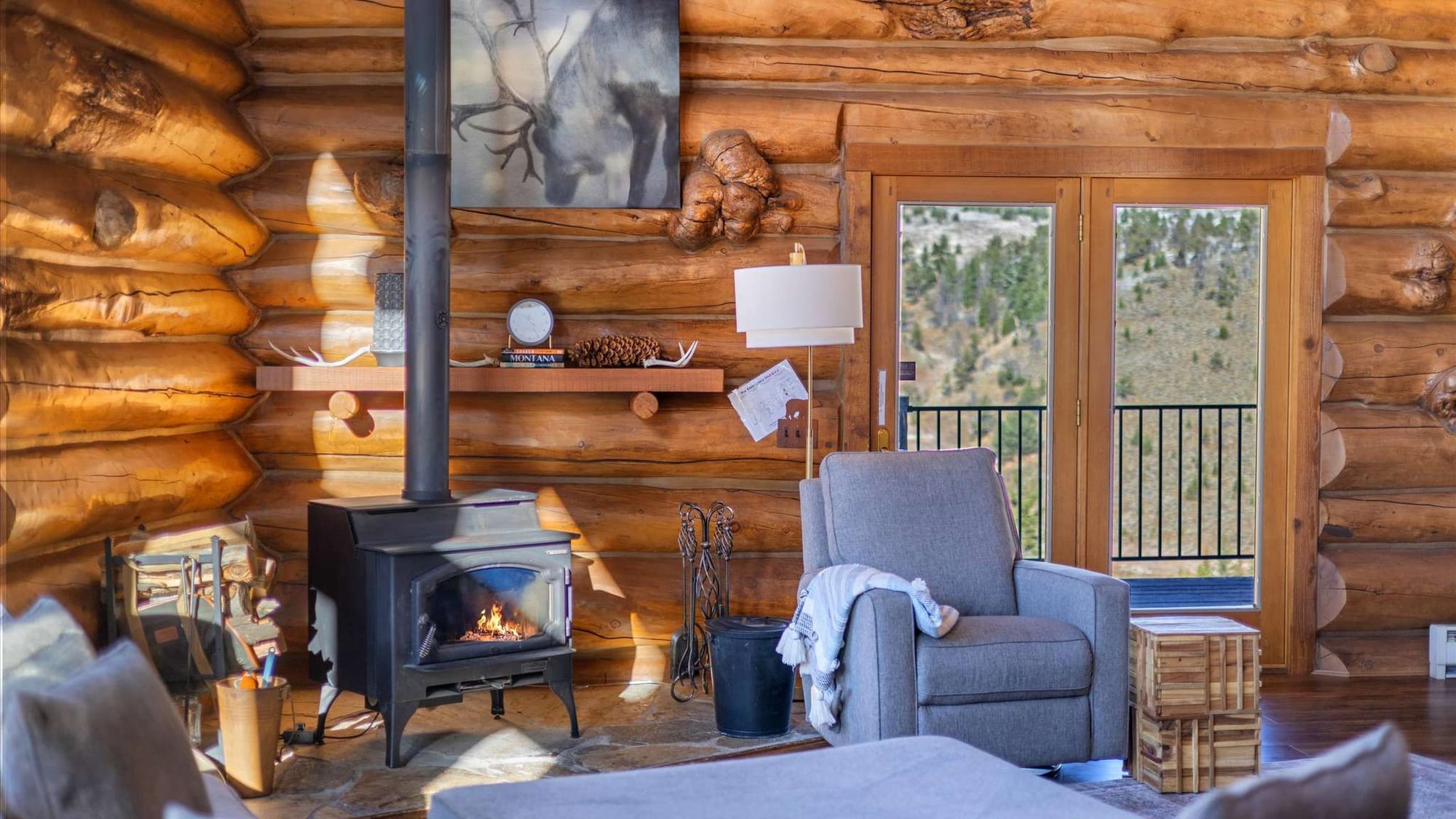 Cozy log cabin interior, fireplace.