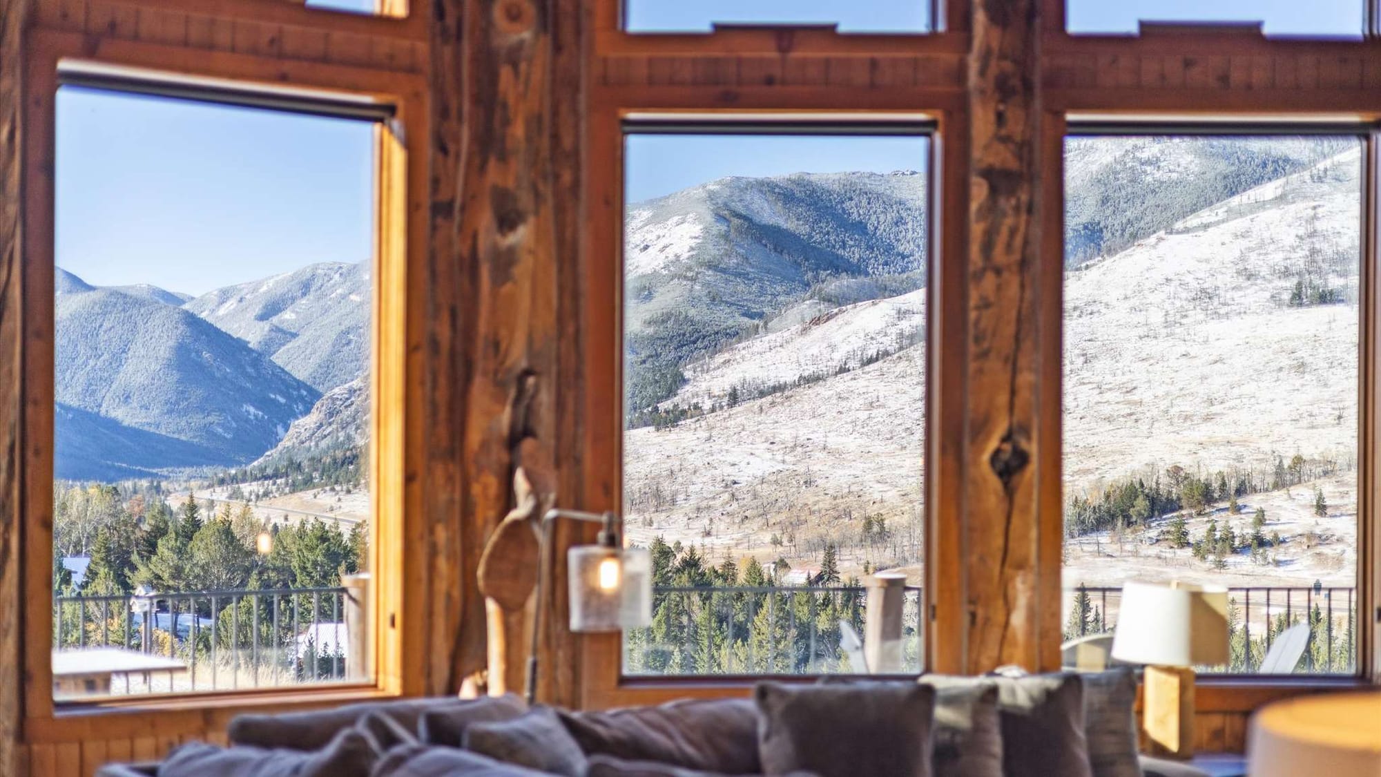 Mountain view through large windows.