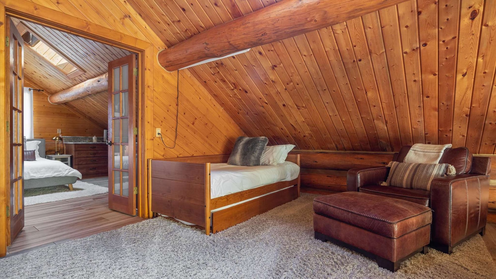 Cozy wooden attic bedroom space.