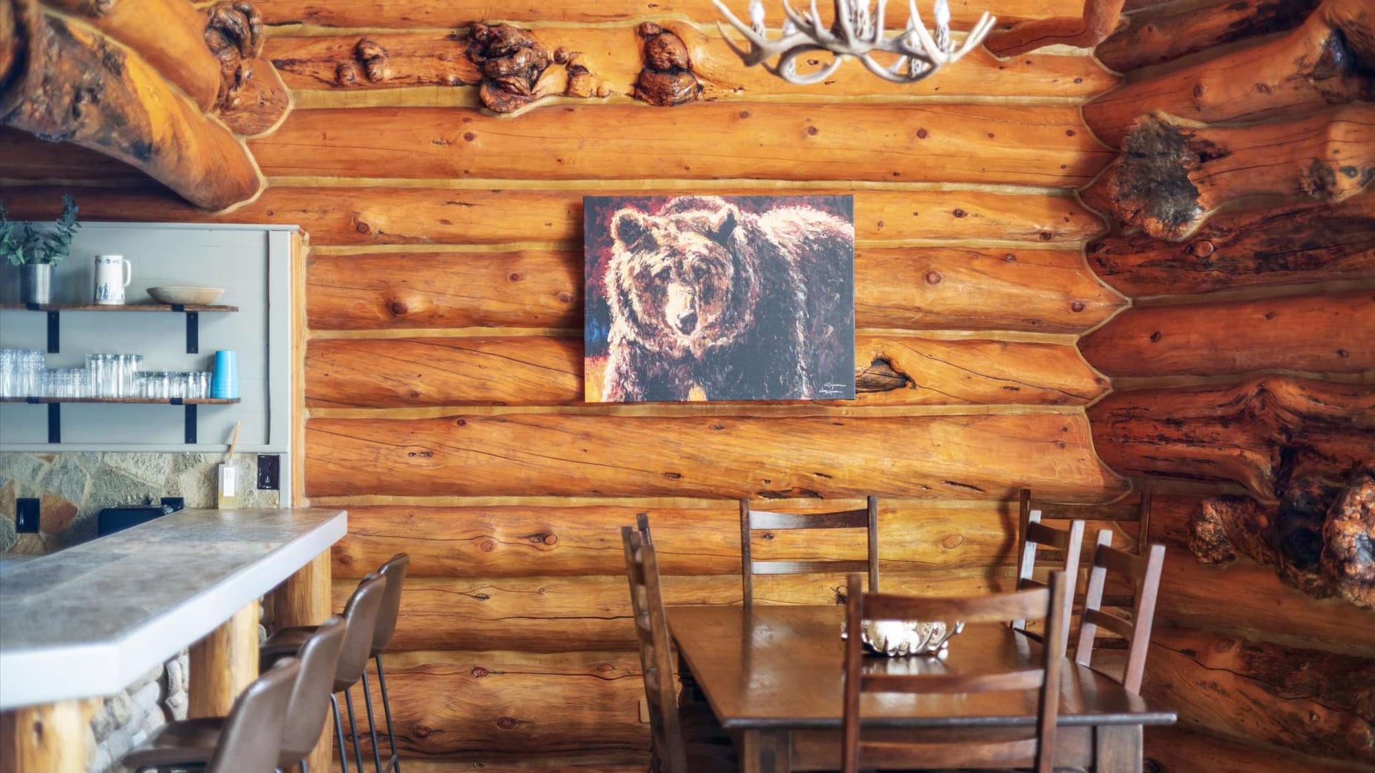 Rustic cabin interior with bear painting.