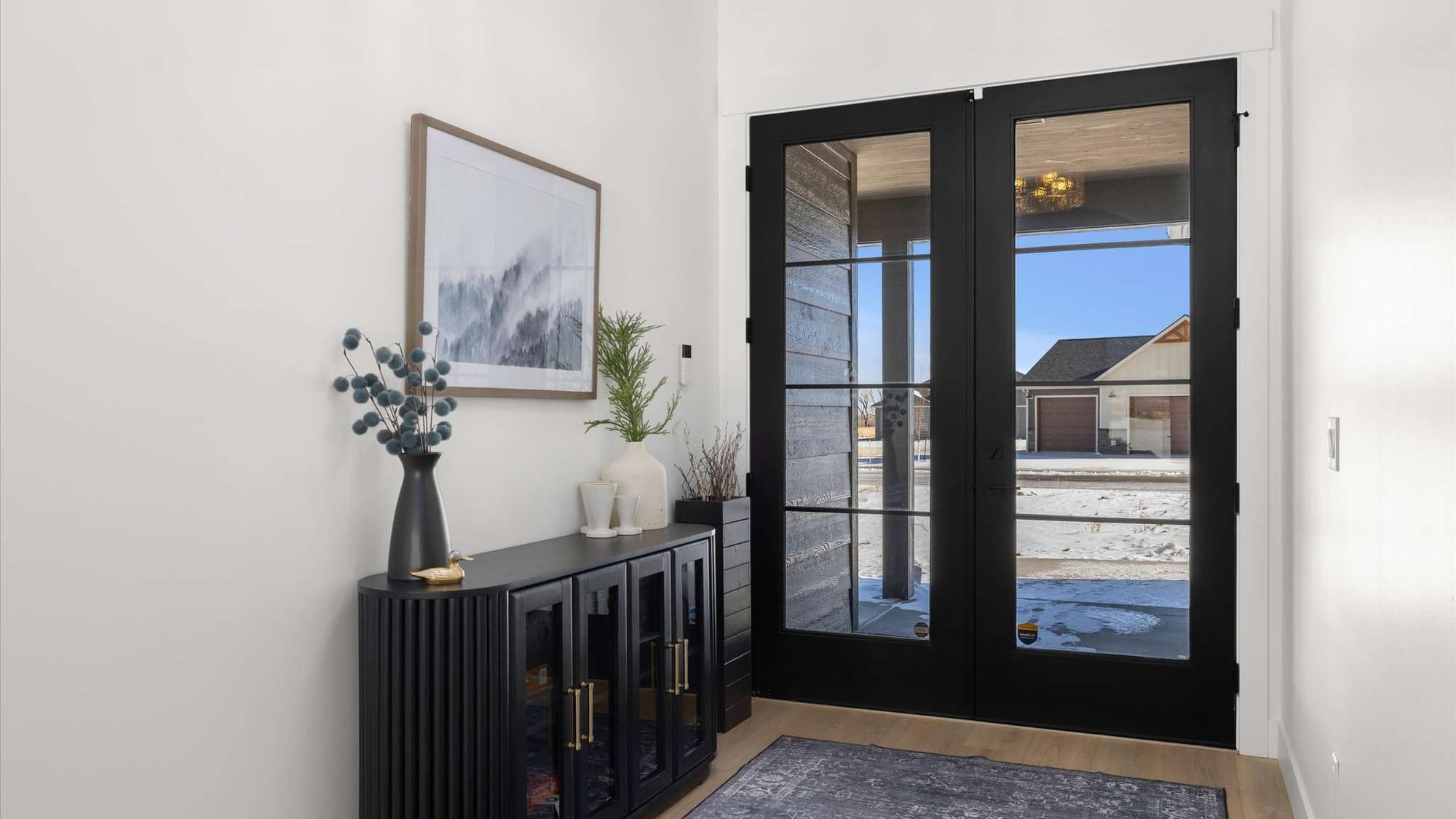 Modern entryway with glass doors.