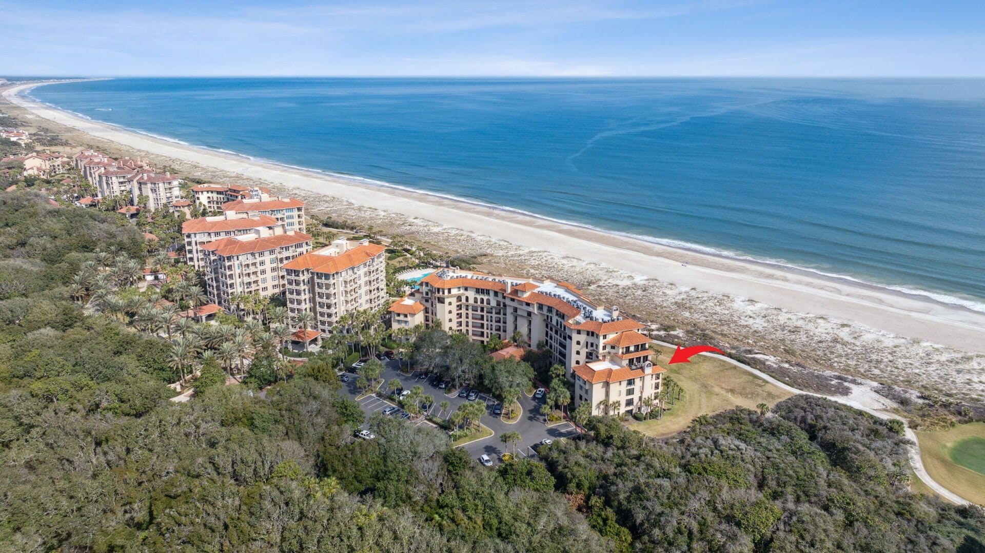 Beachfront resort buildings aerial view.