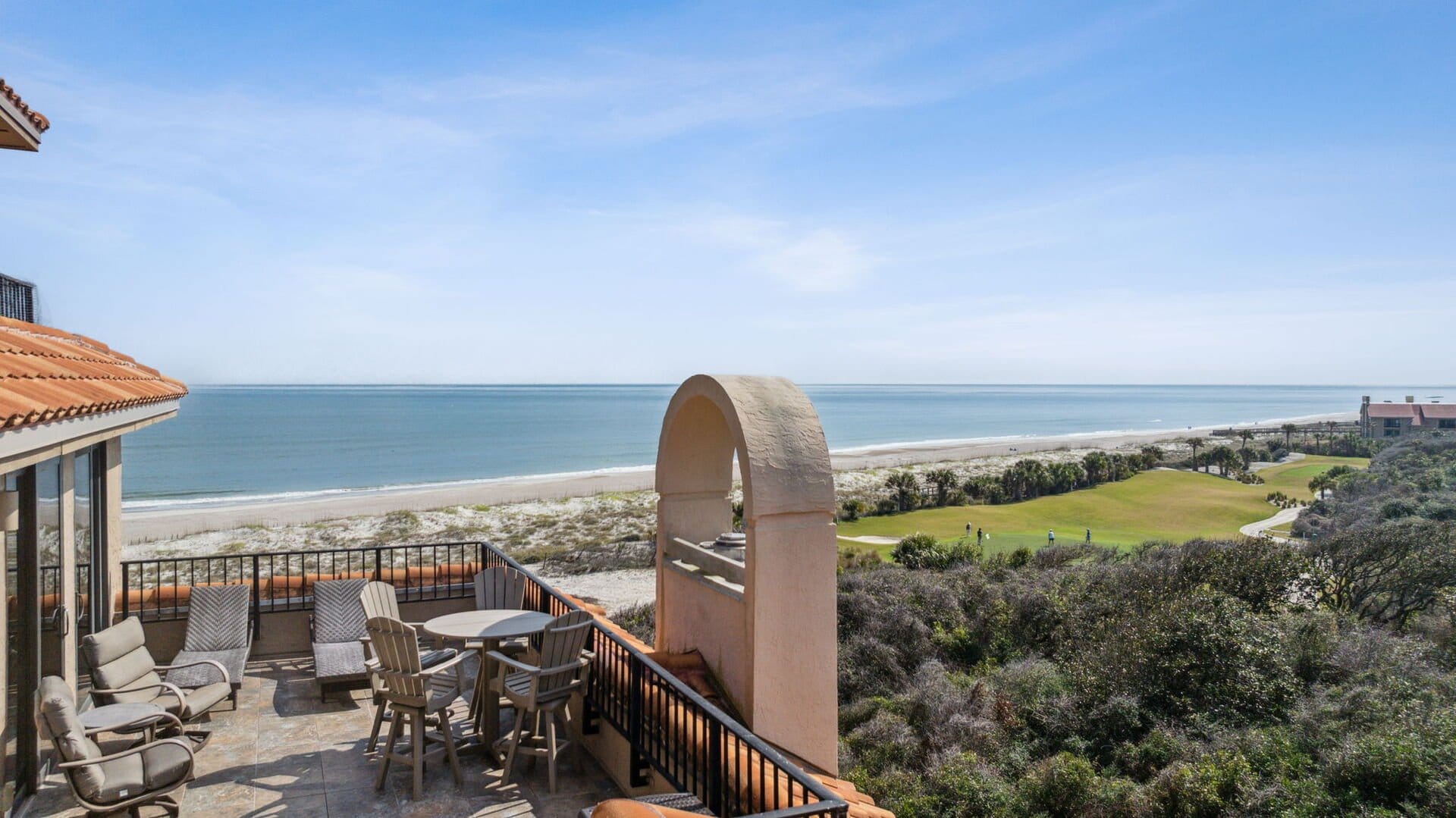 Beachfront patio with ocean view.