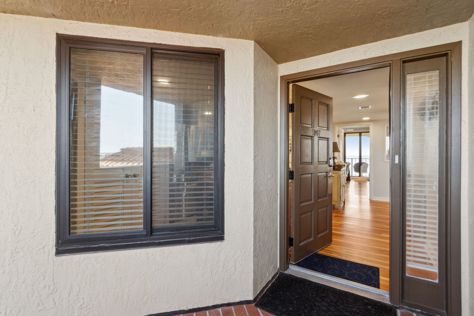 Open brown door to home interior.