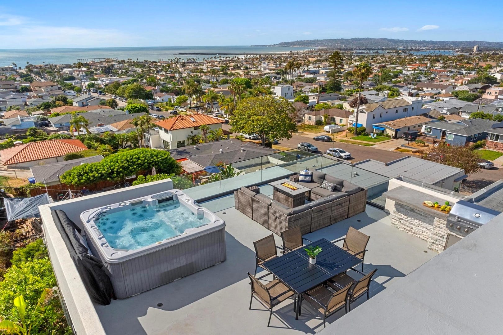 Rooftop patio with hot tub, view.