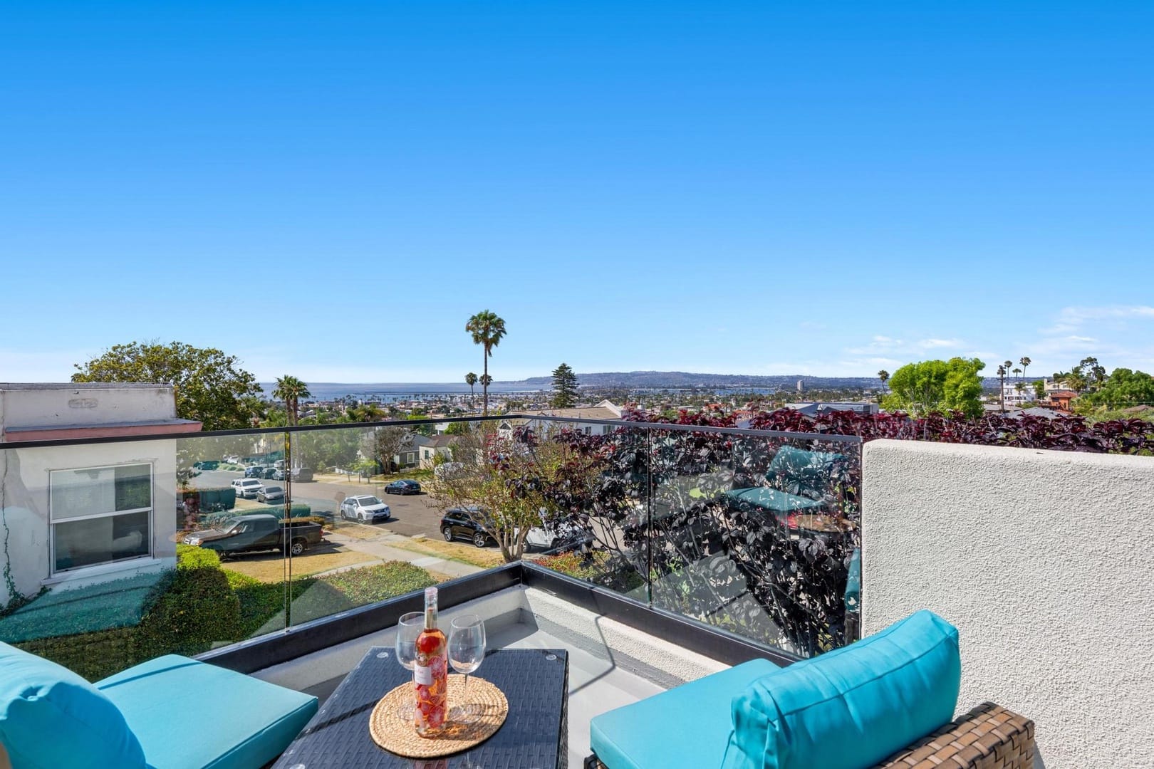 Balcony with city and ocean view.