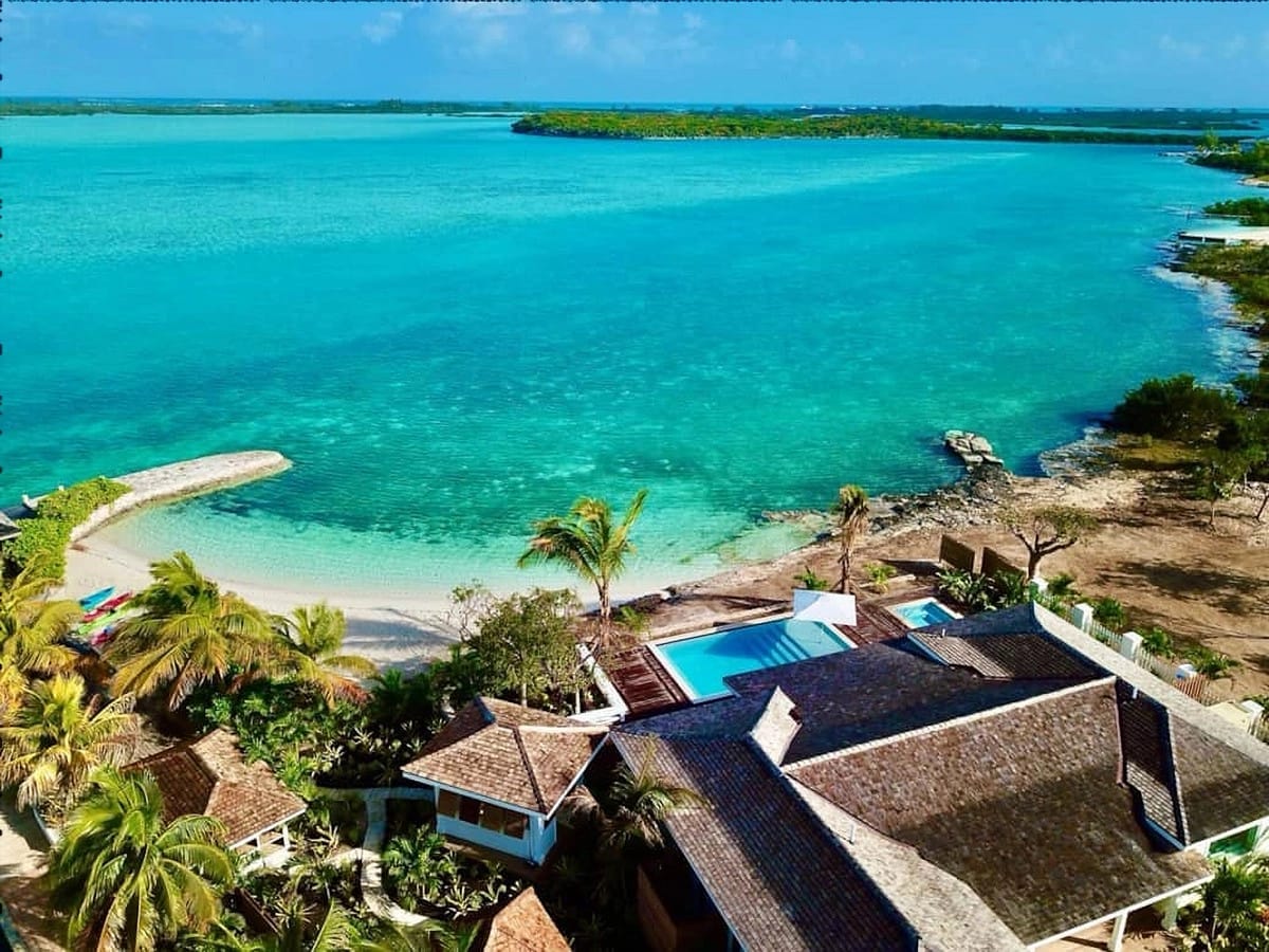 Tropical beachfront villas and pool.