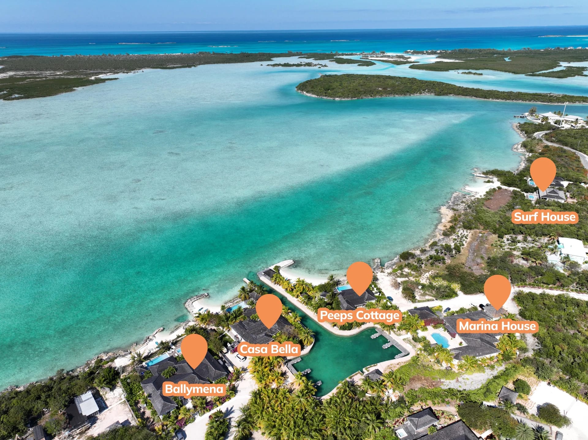 Tropical coastline with labeled houses.