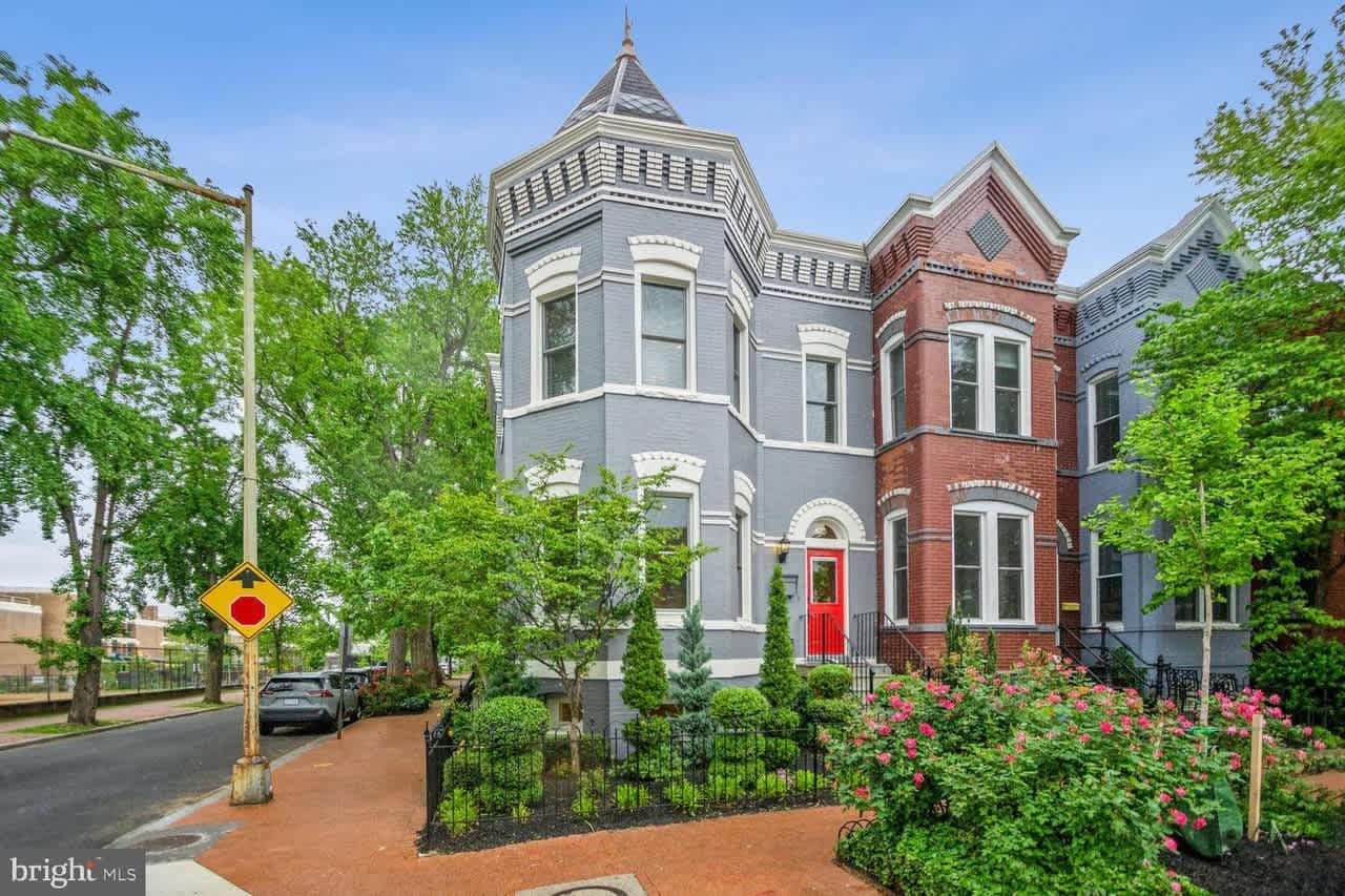 Victorian house with red door.