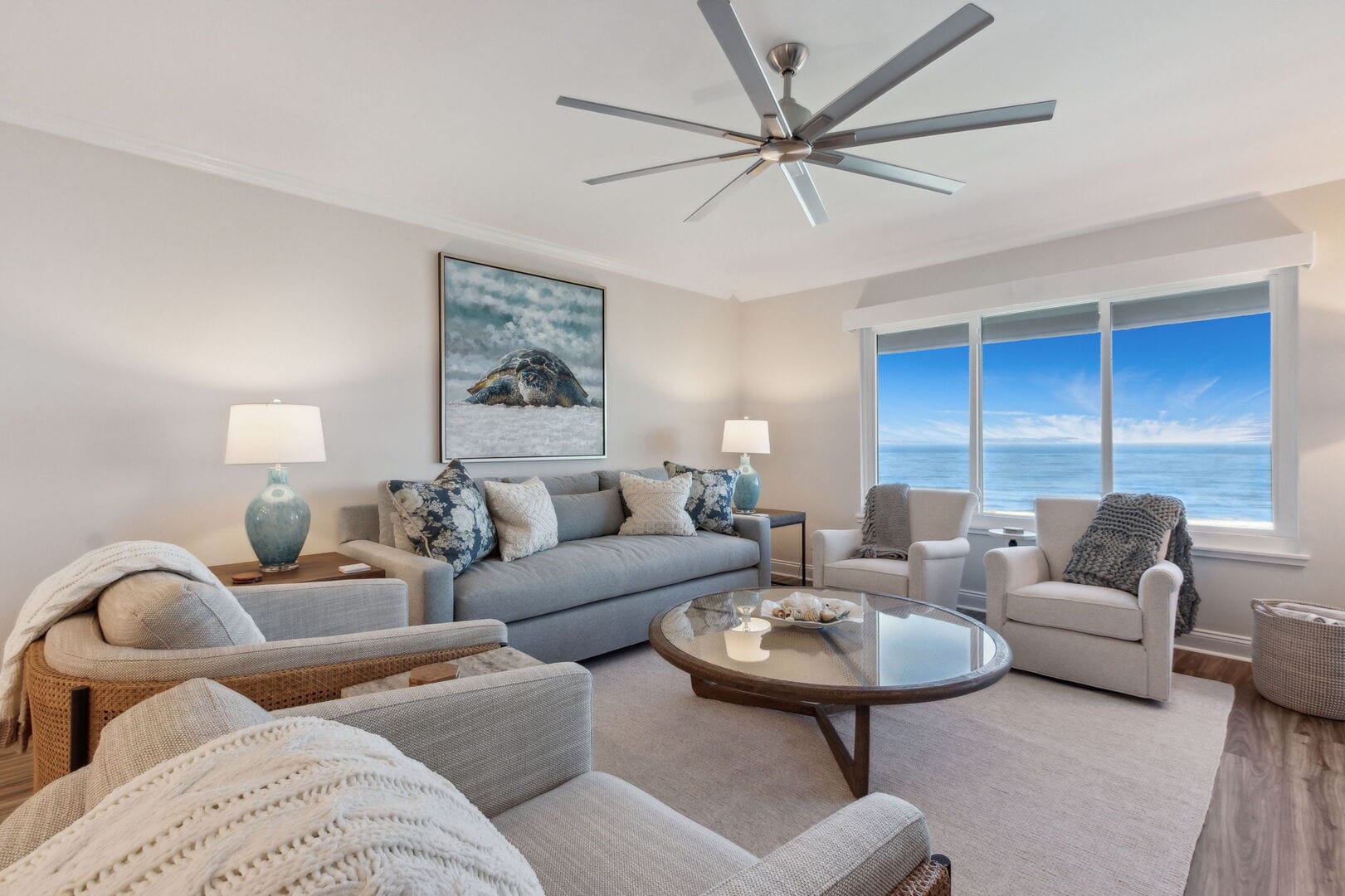 Ocean-view living room with sofas.