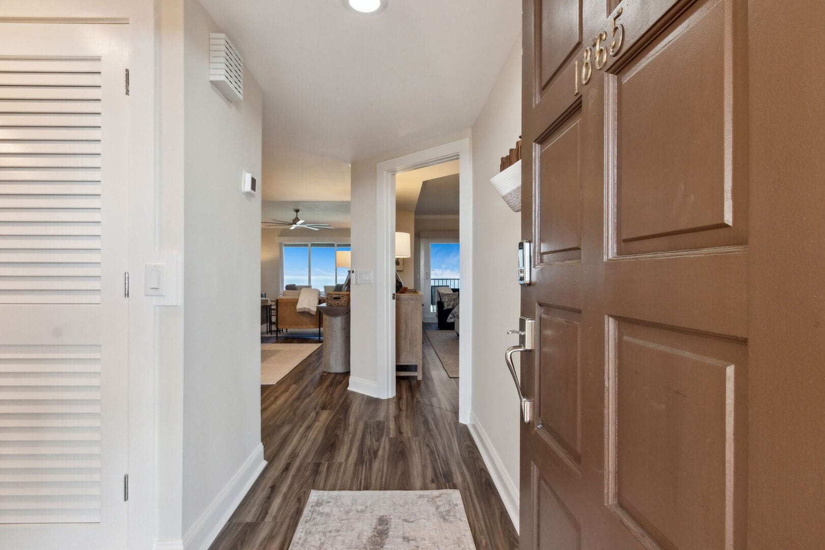 Open door to modern apartment interior.