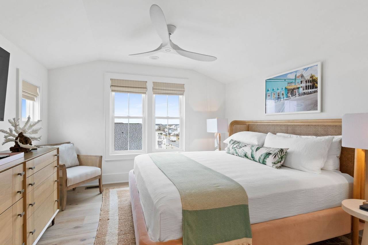 Bright minimalist bedroom with bed.