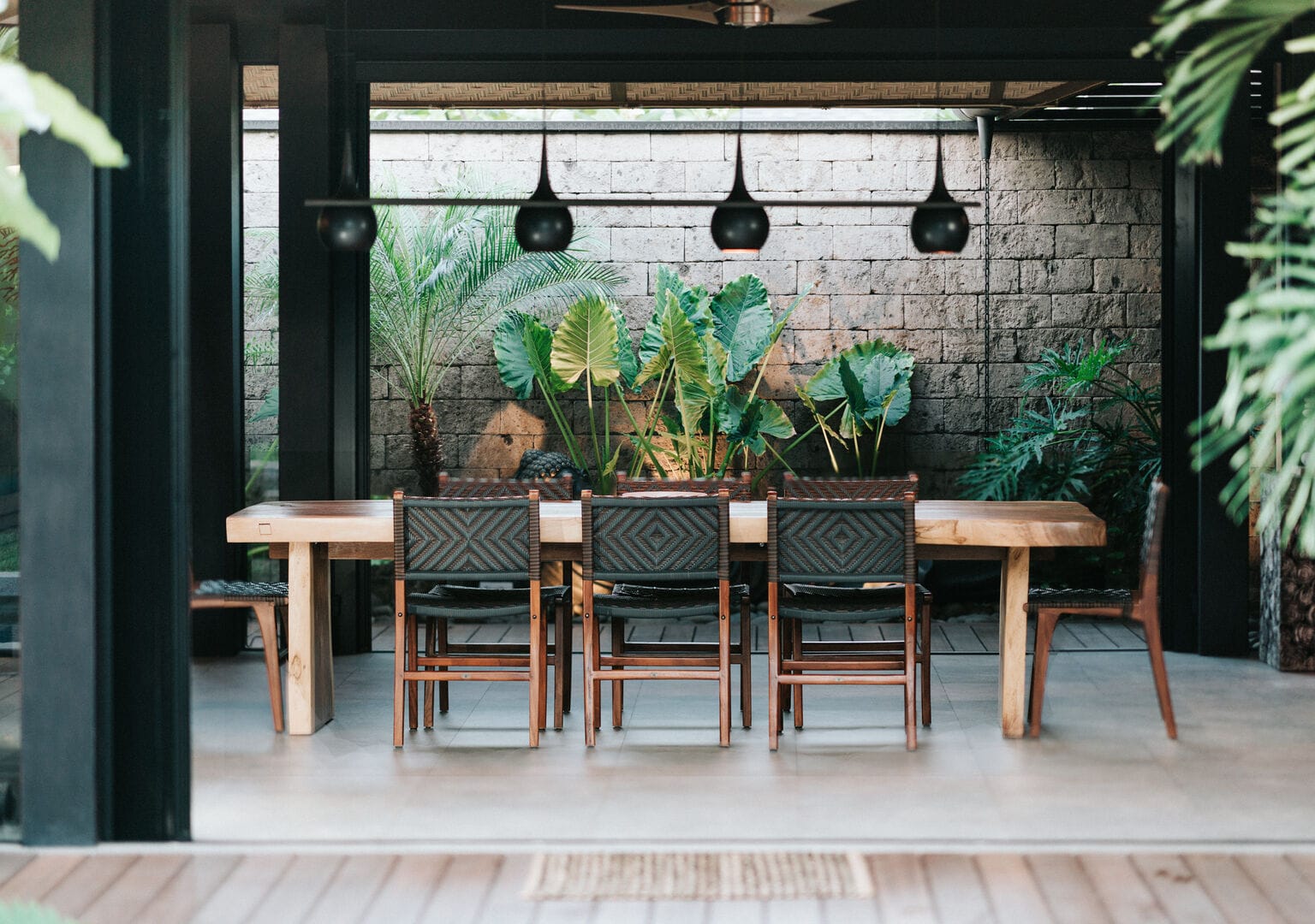 Outdoor dining area with plants.