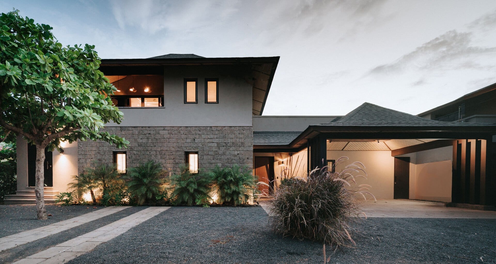 Modern house with tree, driveway.