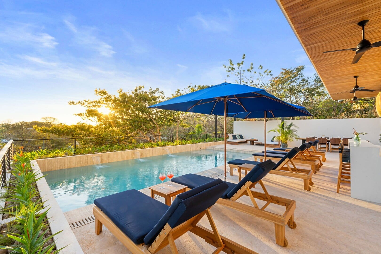 Poolside with loungers and umbrellas.