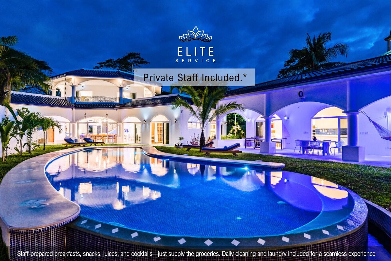 Luxury villa with illuminated pool.
