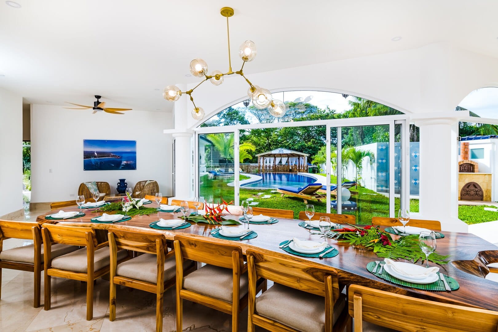 Dining room overlooking pool outside.