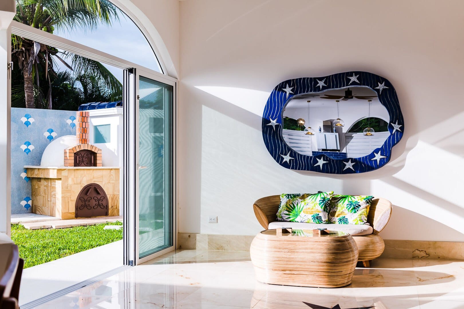 Bright room with tropical decor.