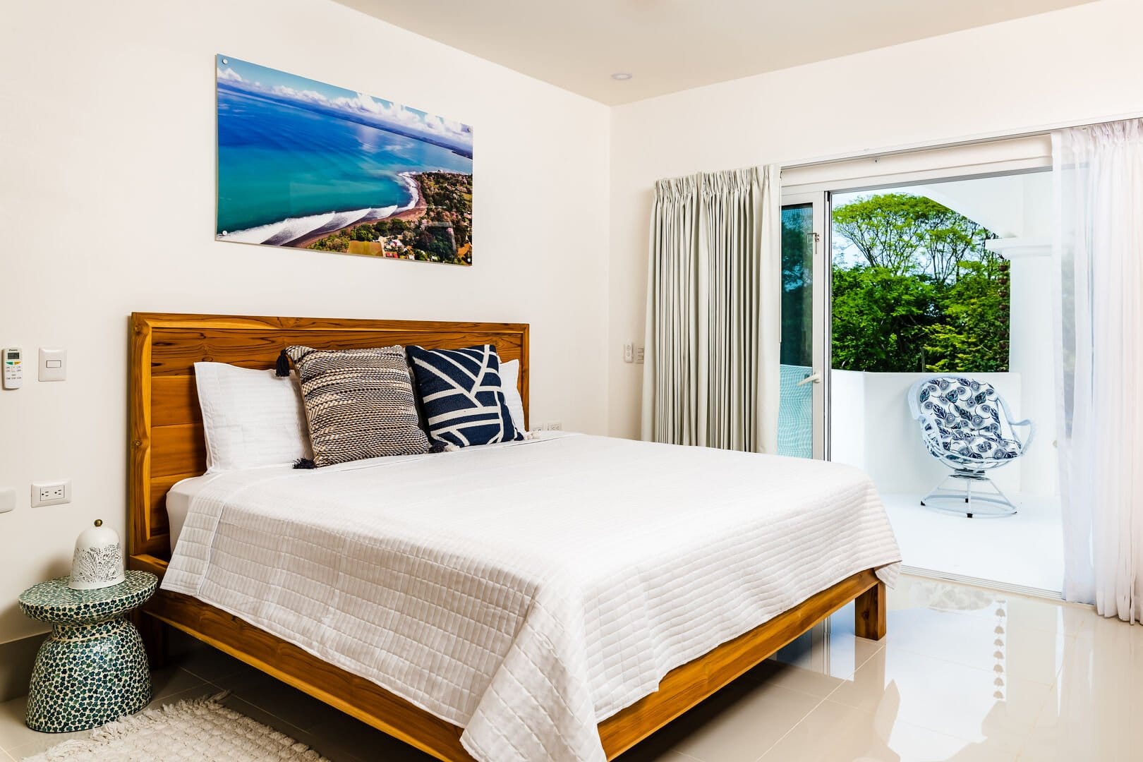 Modern bedroom with balcony view.