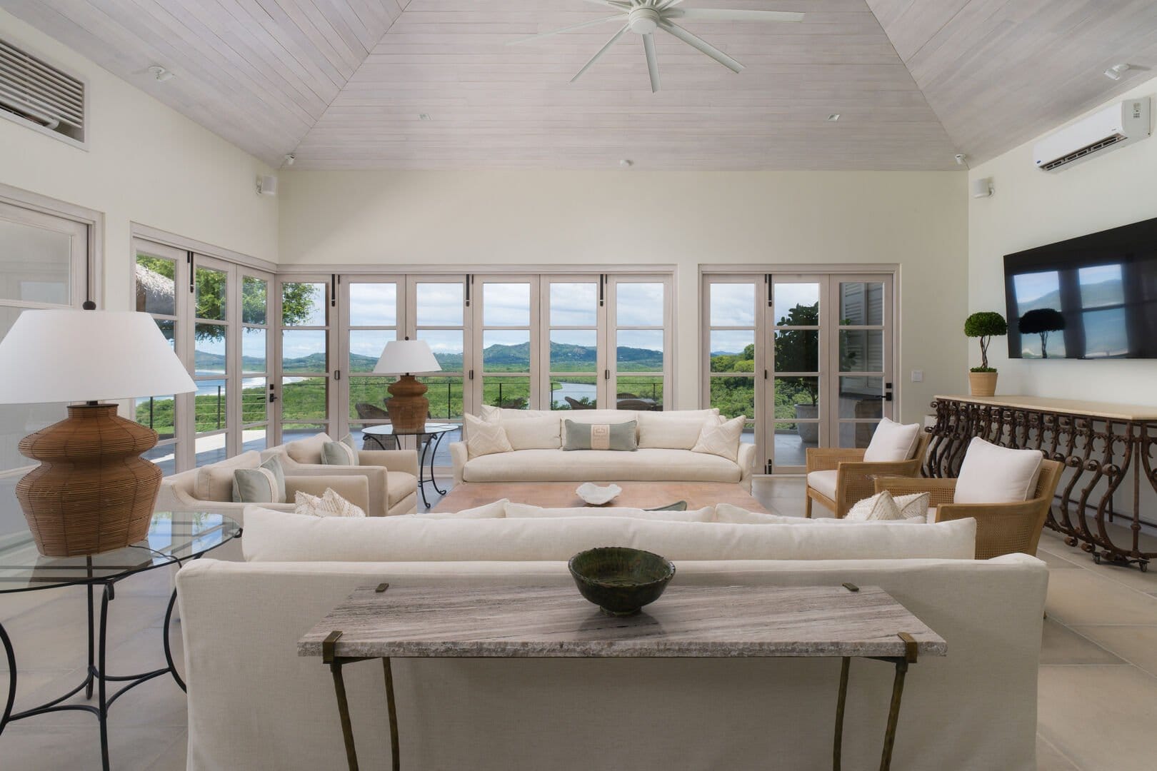 Spacious living room with large windows.