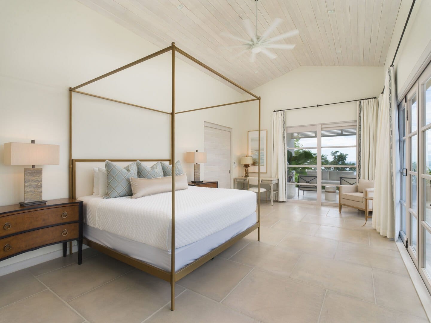 Spacious bedroom with canopy bed.