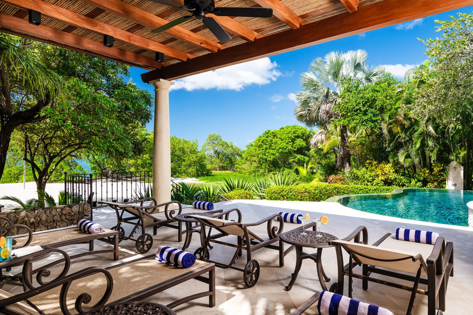 Poolside patio with lounge chairs.