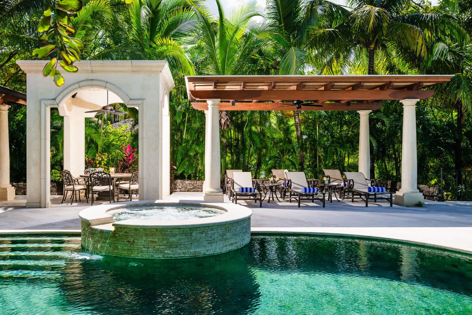 Poolside patio with lounge chairs.