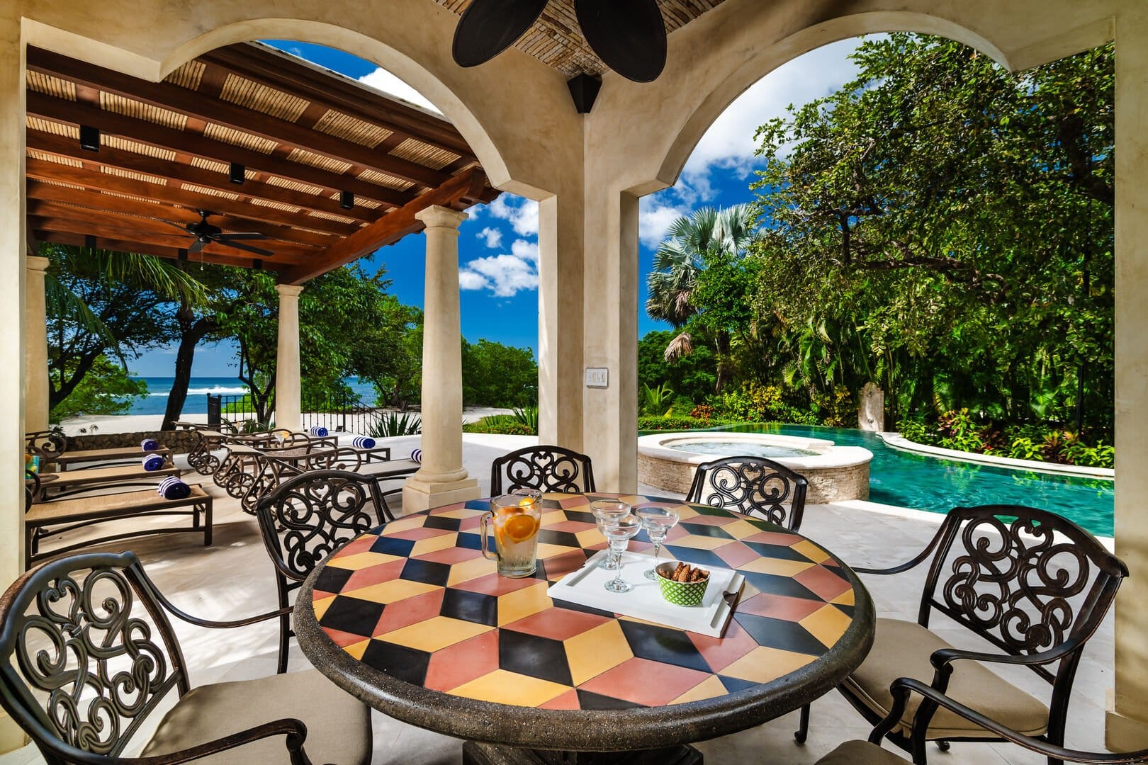 Outdoor patio with pool view.