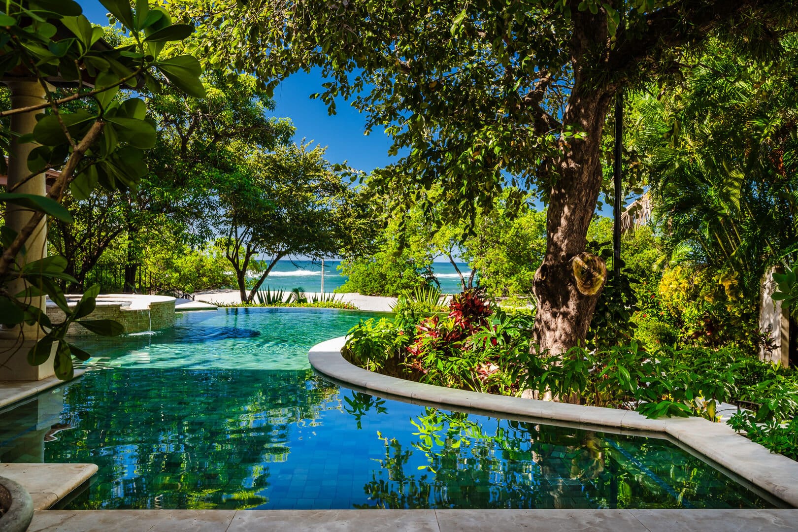 Tropical pool with ocean view.