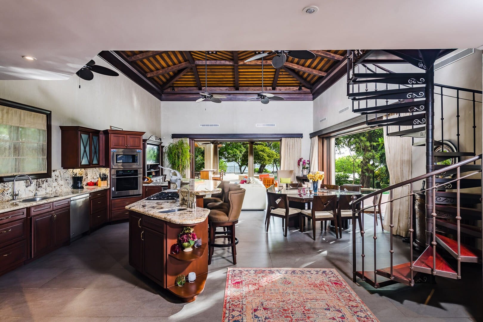 Open kitchen with spiral staircase.