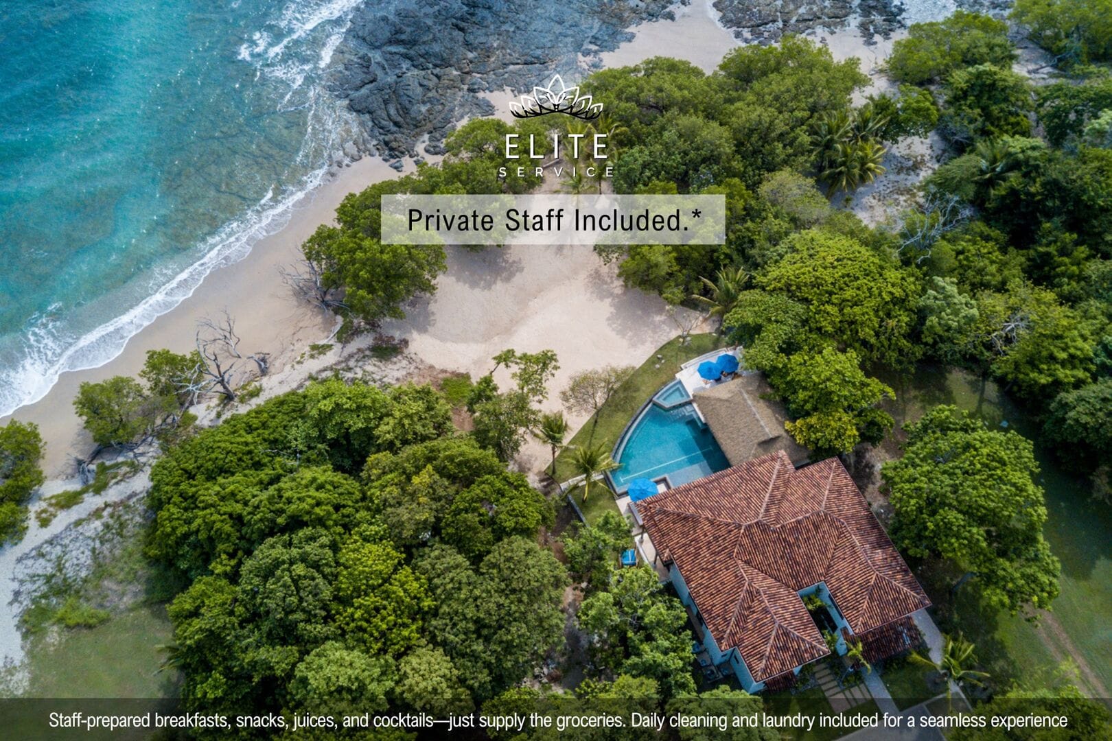 Beachfront villa with lush greenery.