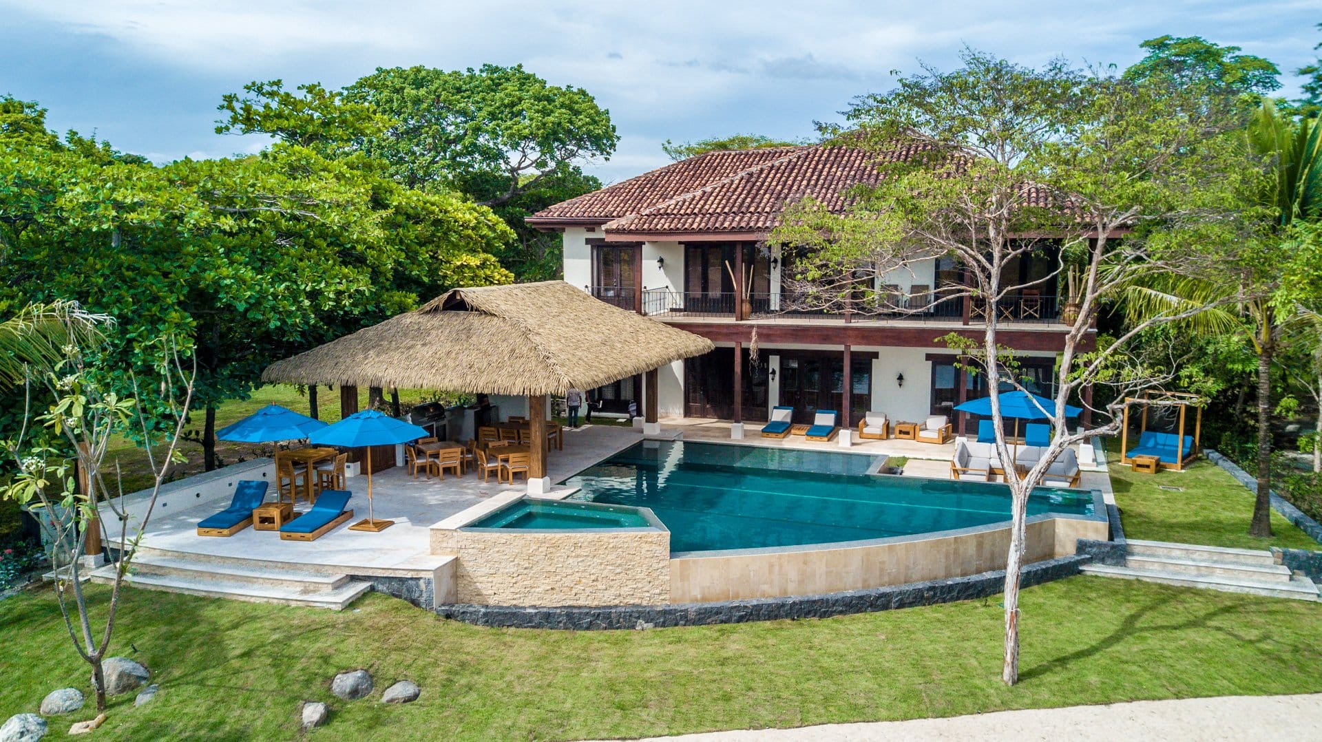 Luxury villa with pool, greenery.