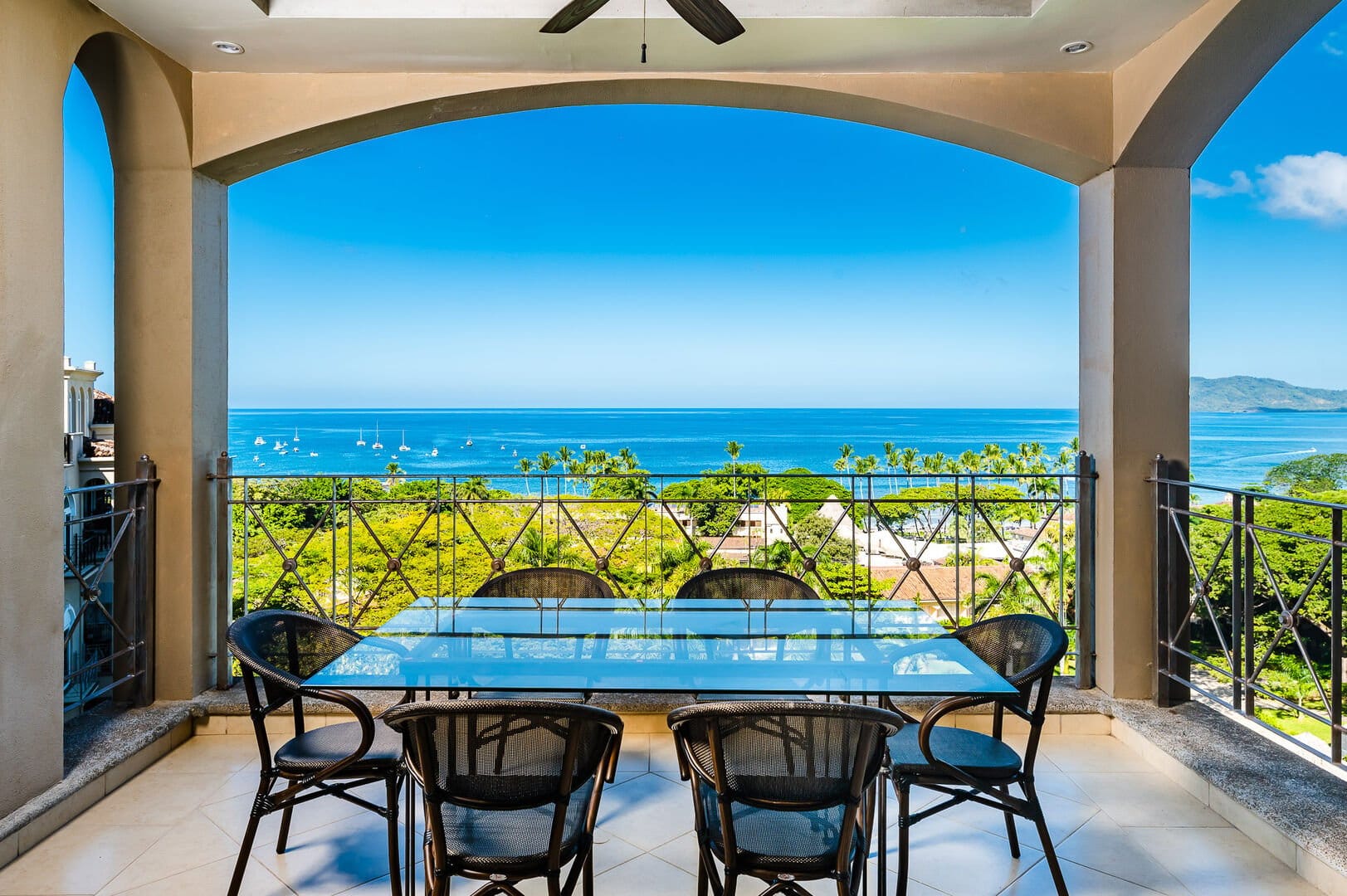 Patio with ocean view, seating area.