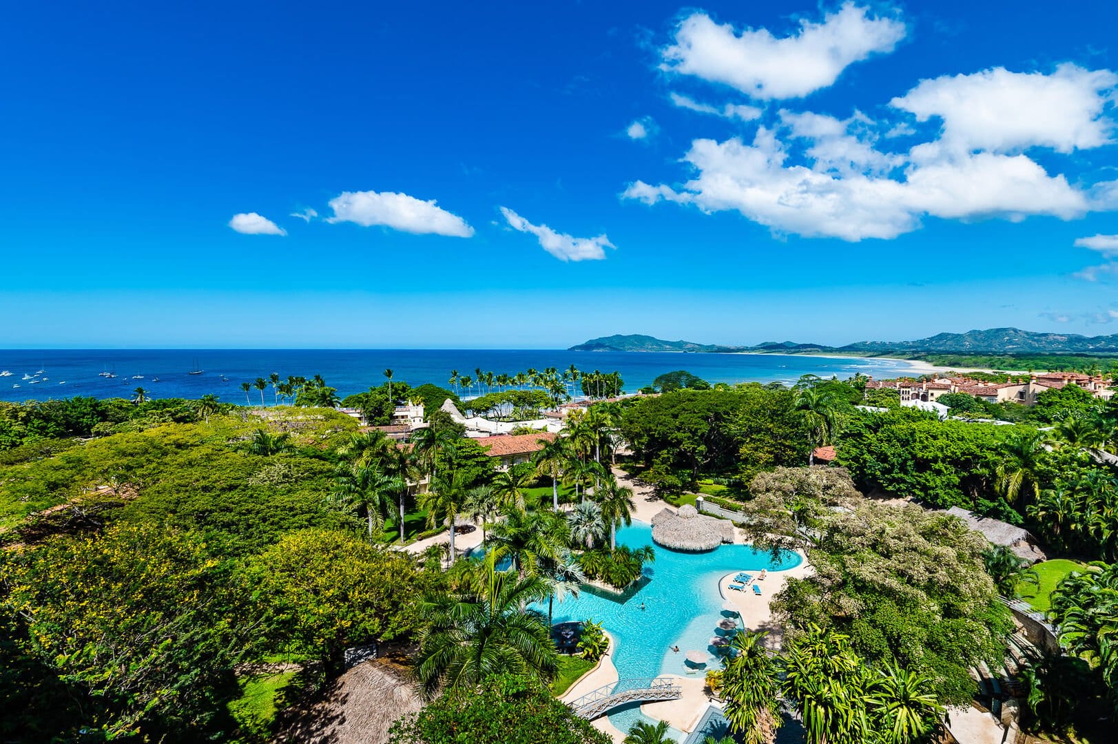 Tropical beach resort with pool.