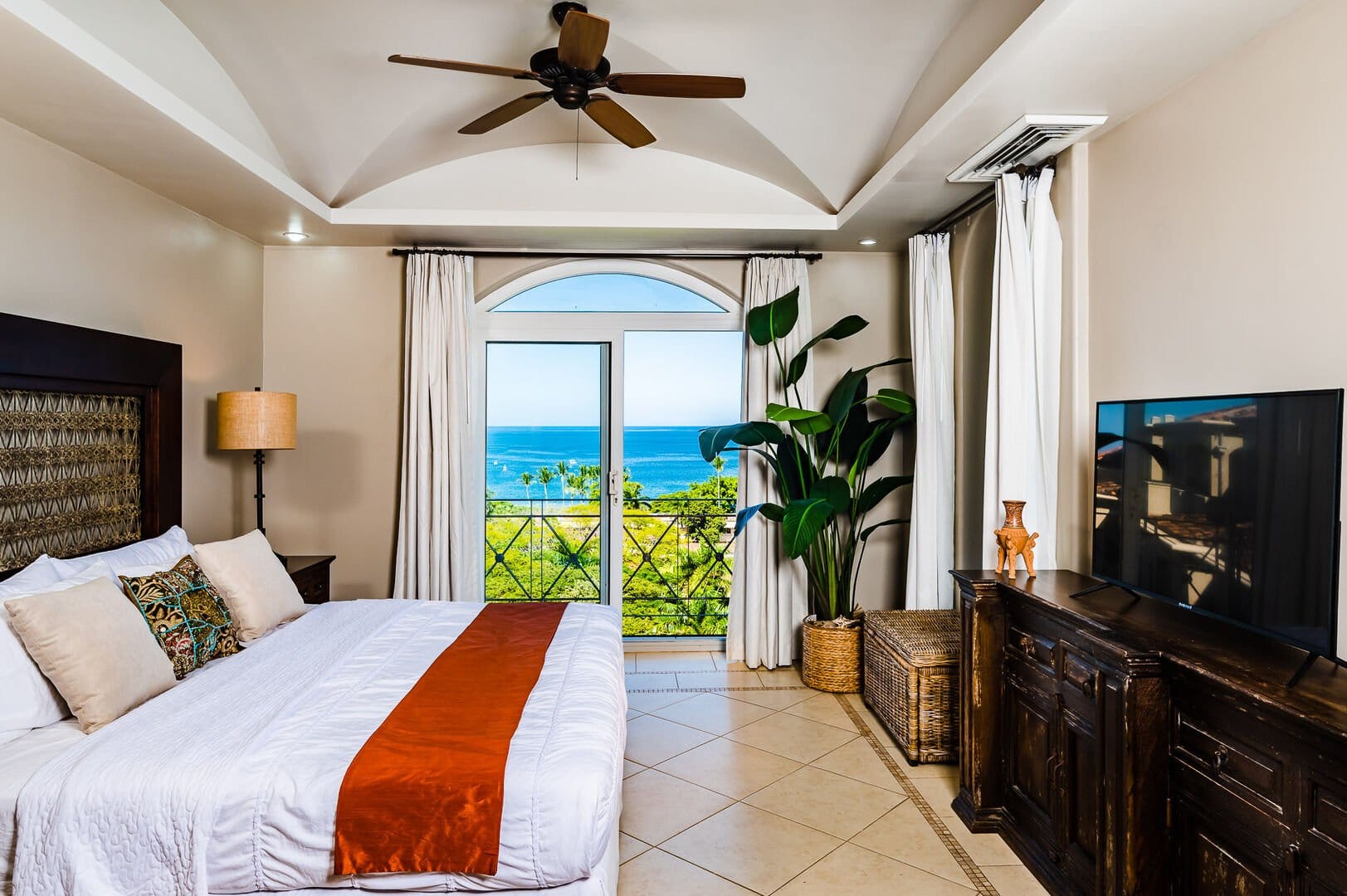 Bedroom with ocean view window.