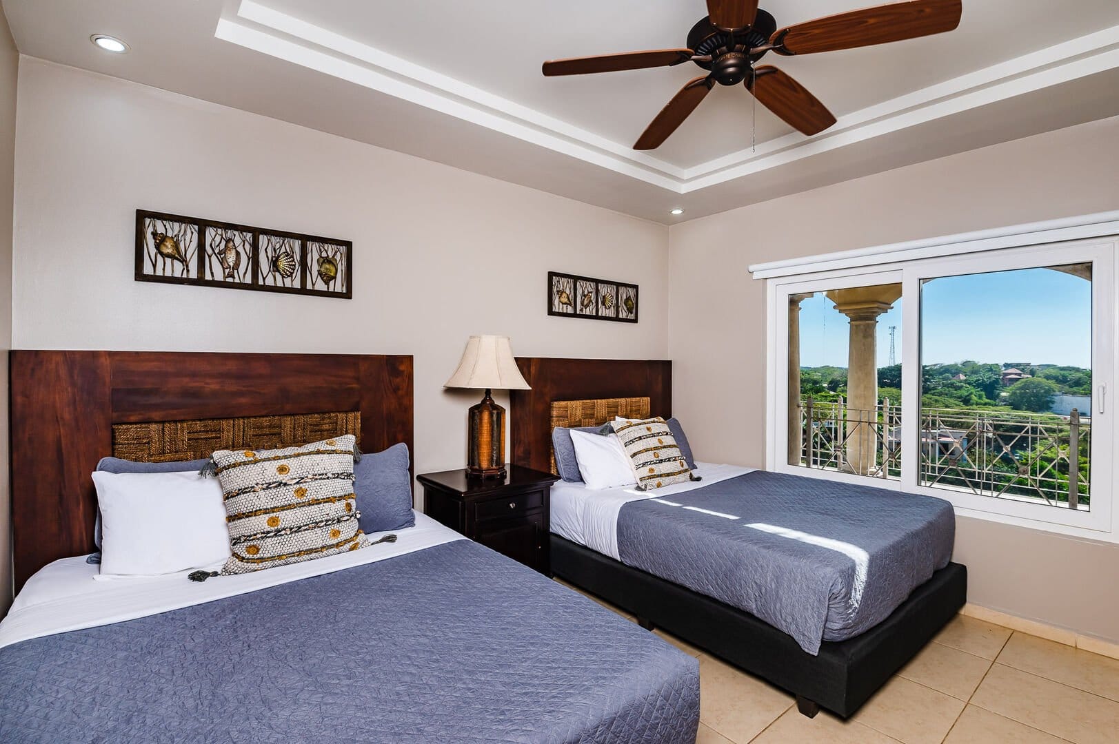 Two beds, room with window.