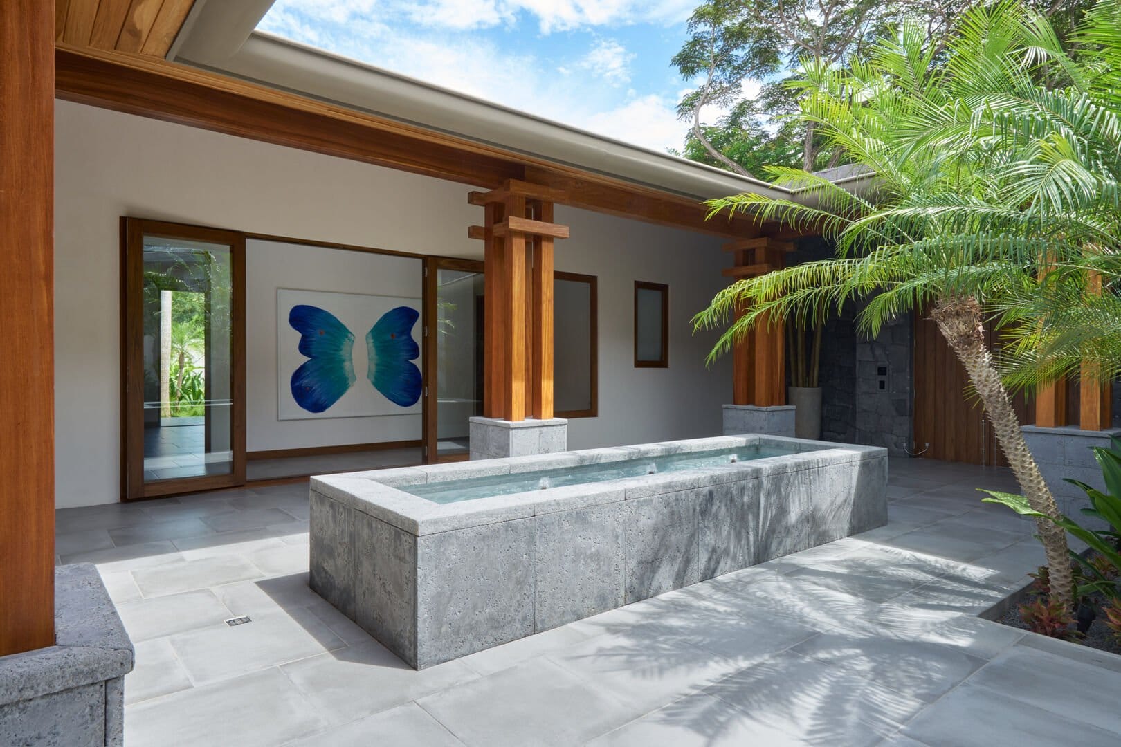 Modern courtyard with central fountain.