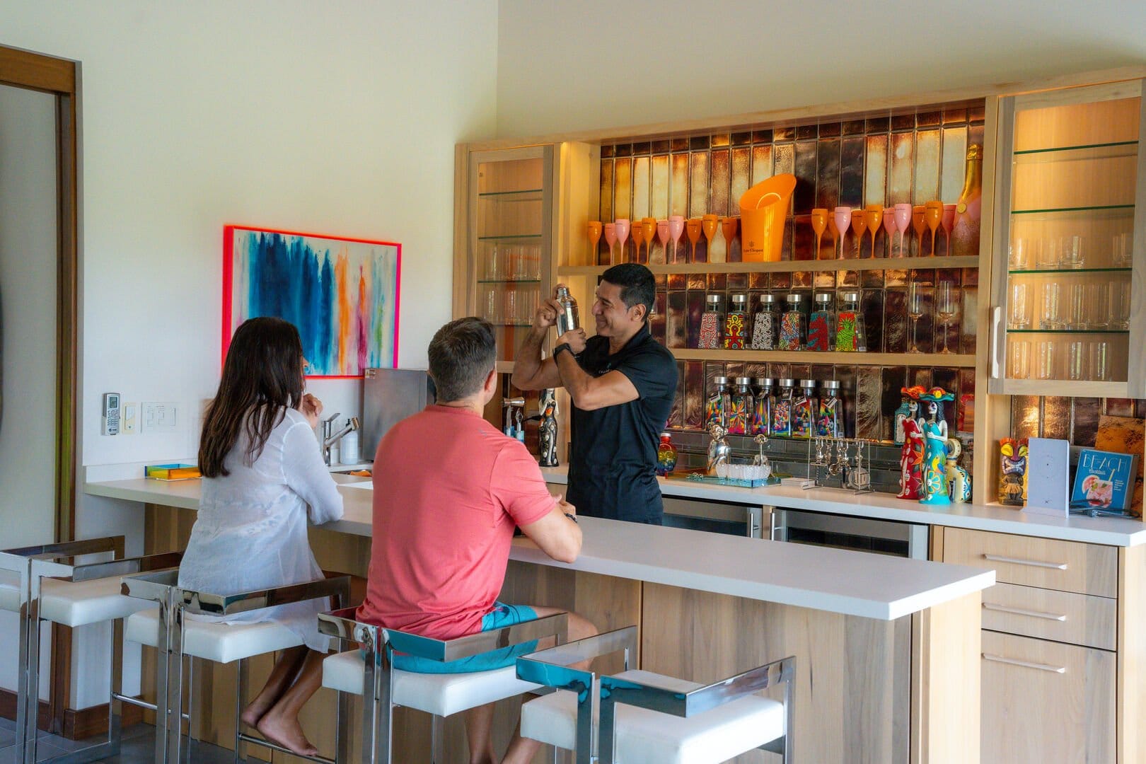 Bartender making drinks for two.