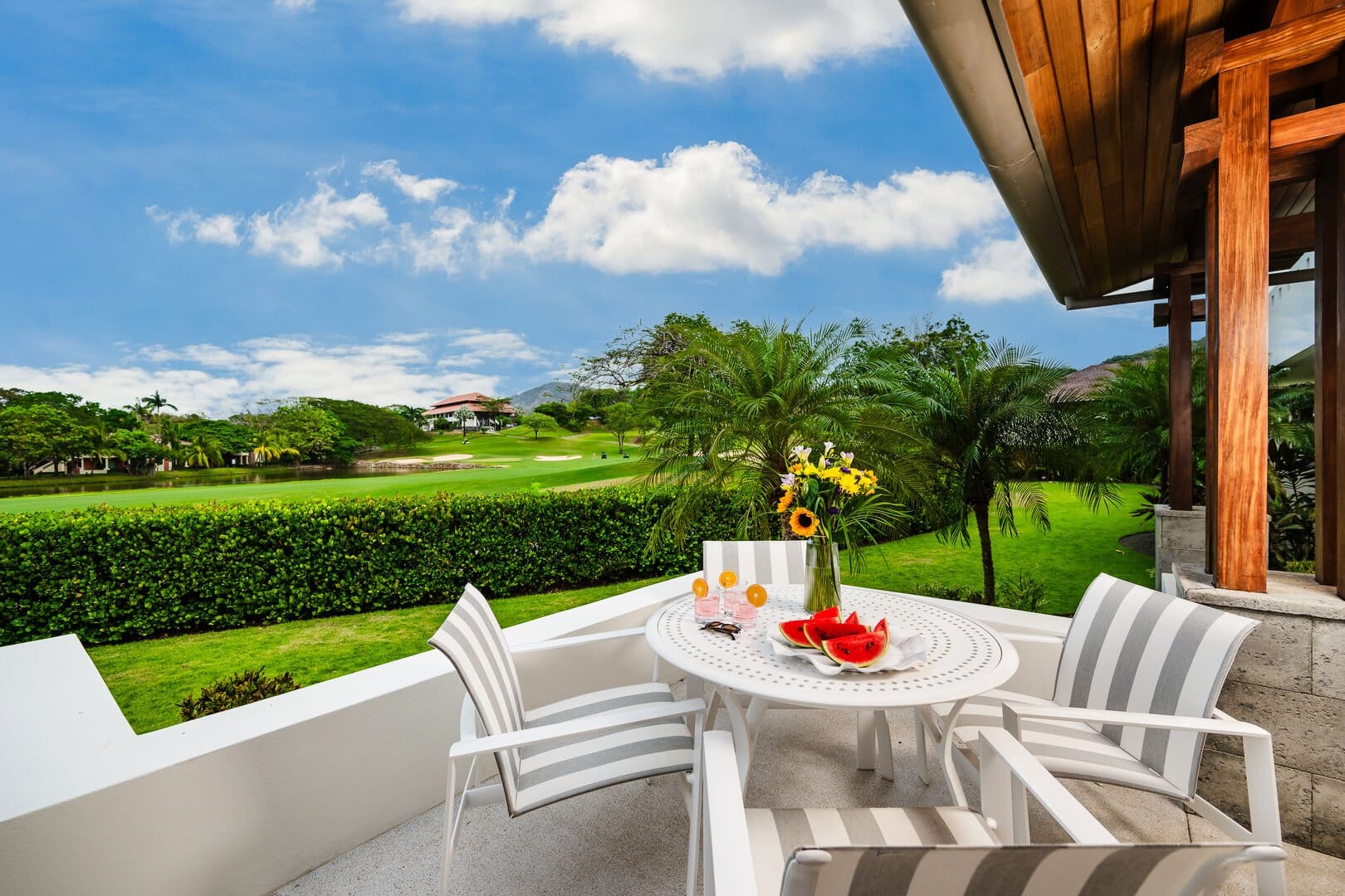 Patio table overlooking lush garden.