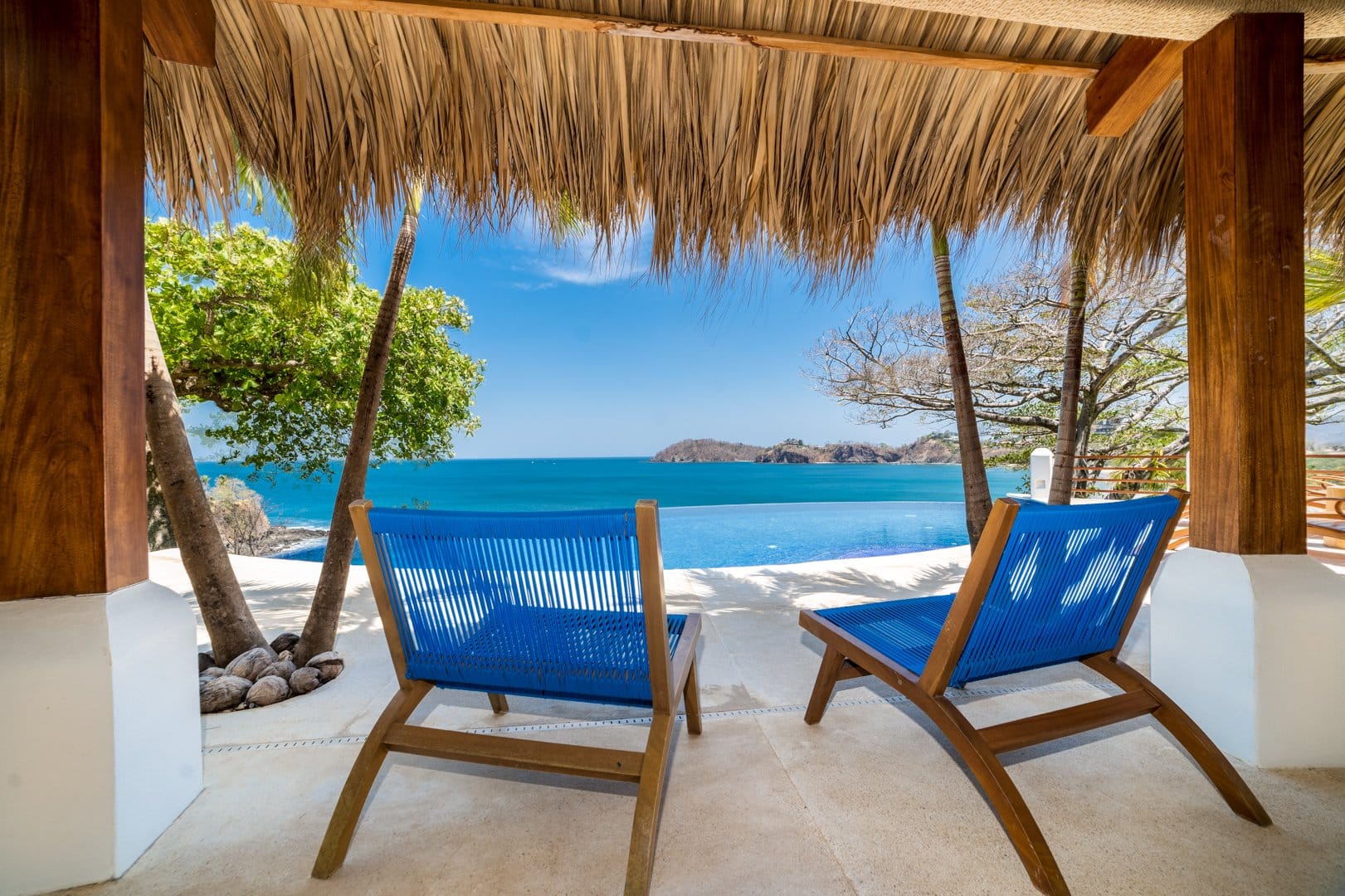 Beach chairs overlooking ocean view.