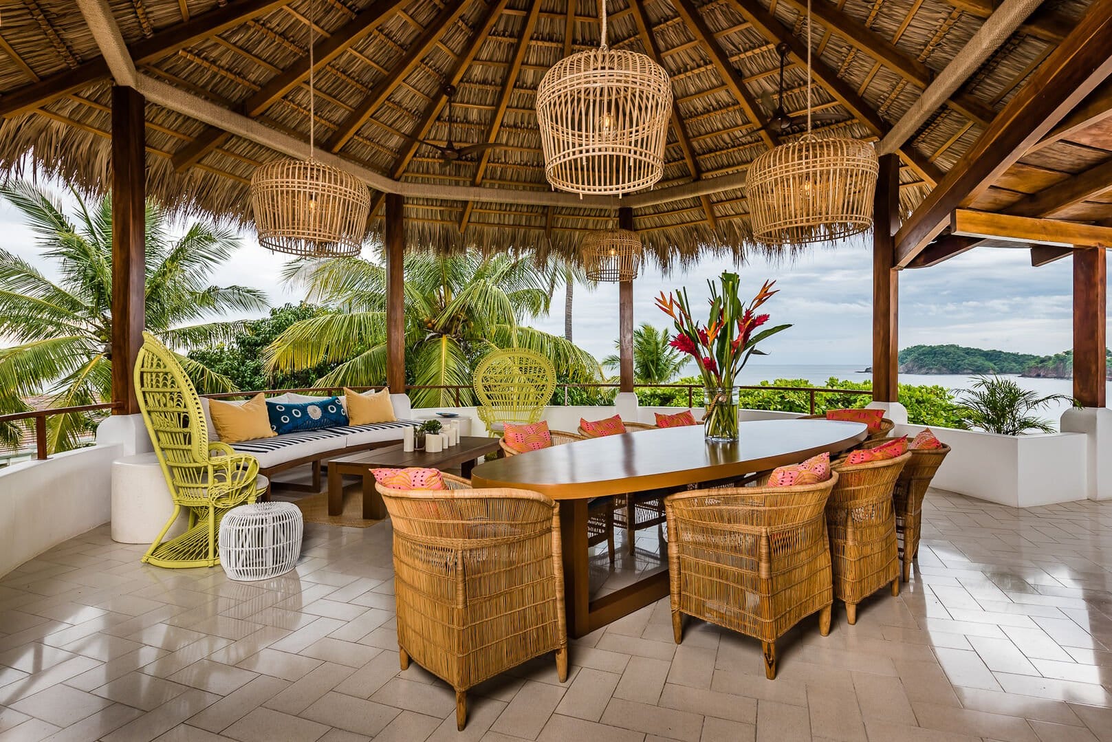 Tropical outdoor dining area, ocean view.