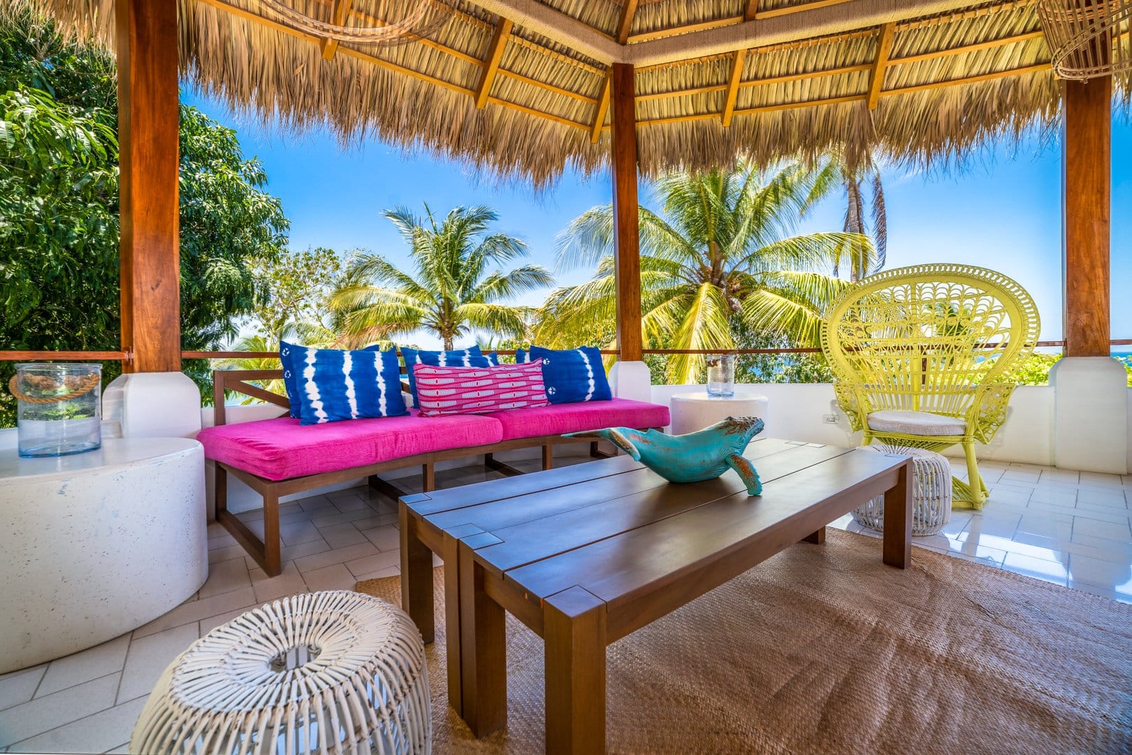 Tropical patio with colorful seating.