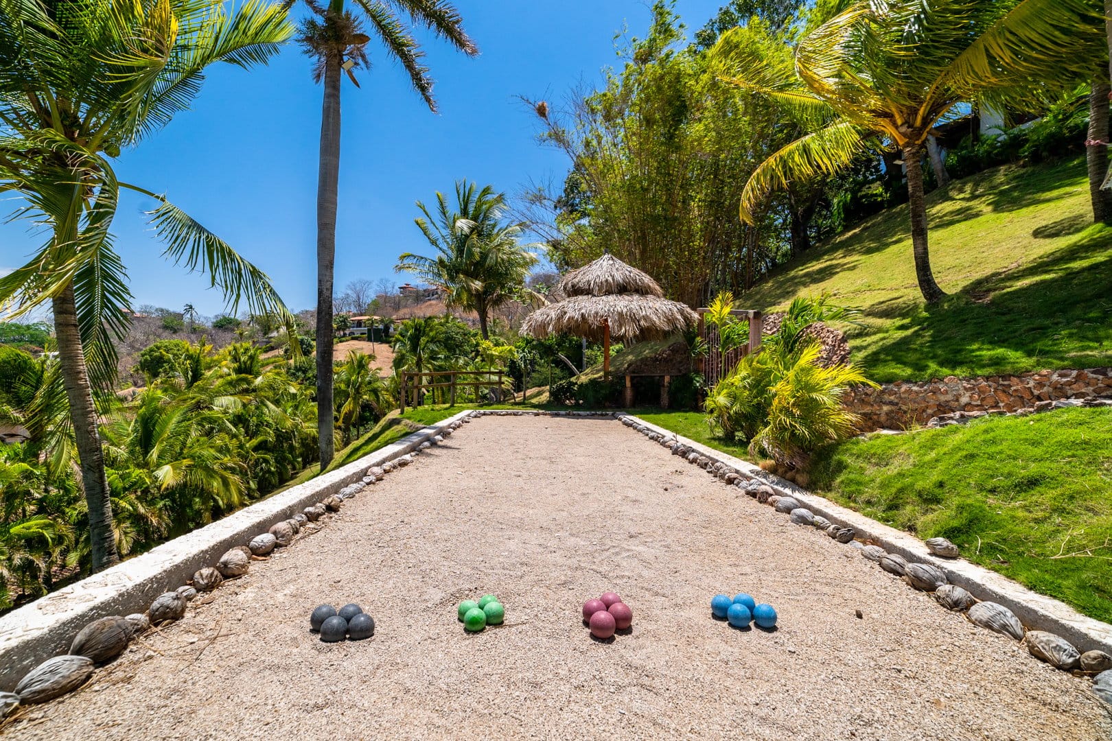 Tropical bocce court with balls.