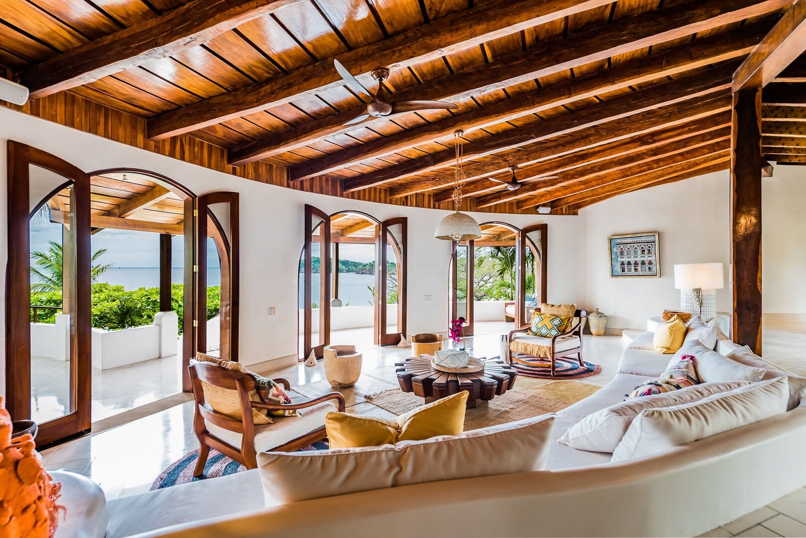Tropical living room, open windows.